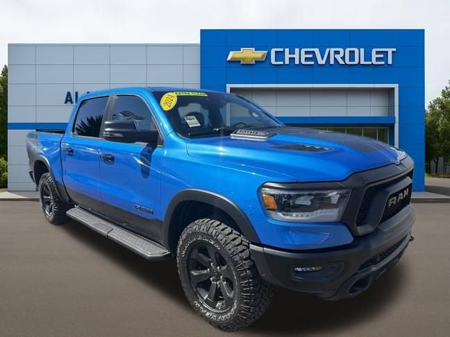 2024 RAM 1500 Rebel Crew Cab 4x4 5'7" Box in Blue — front three-quarter view