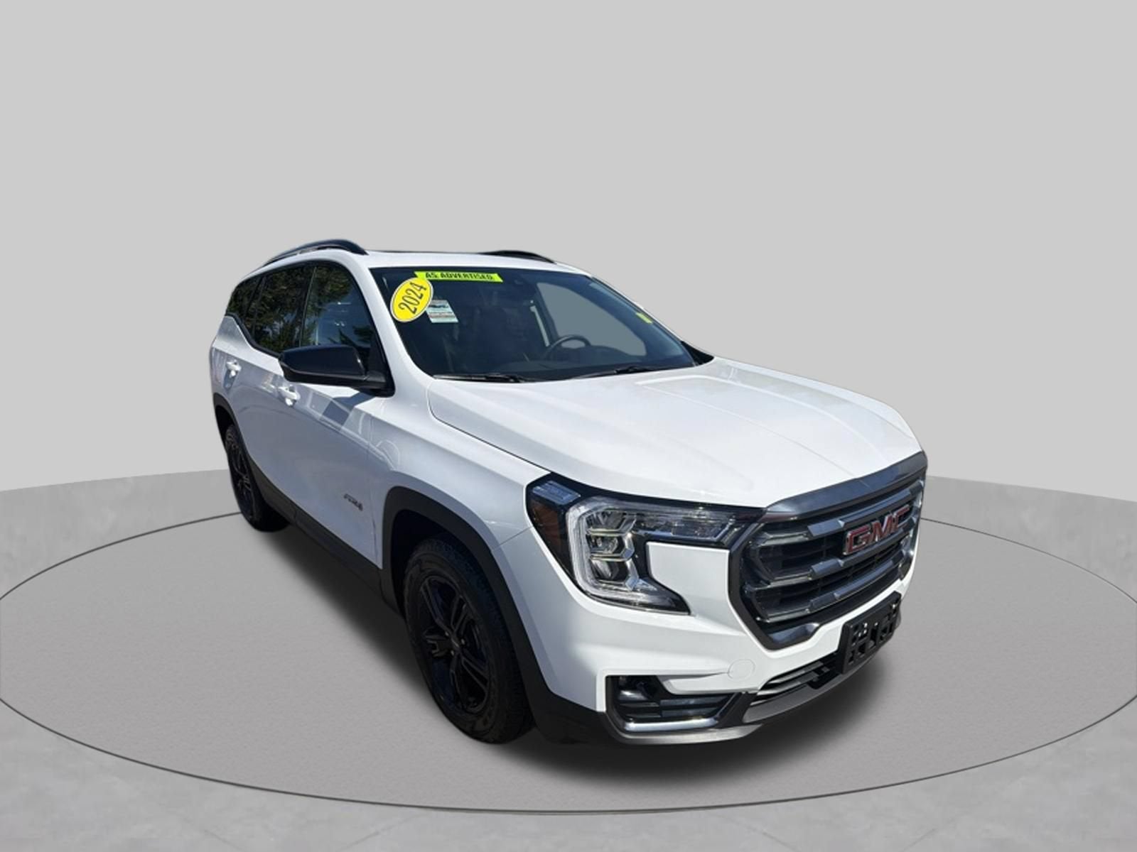 2024 GMC Terrain AT4 in Summit White — front three-quarter view
