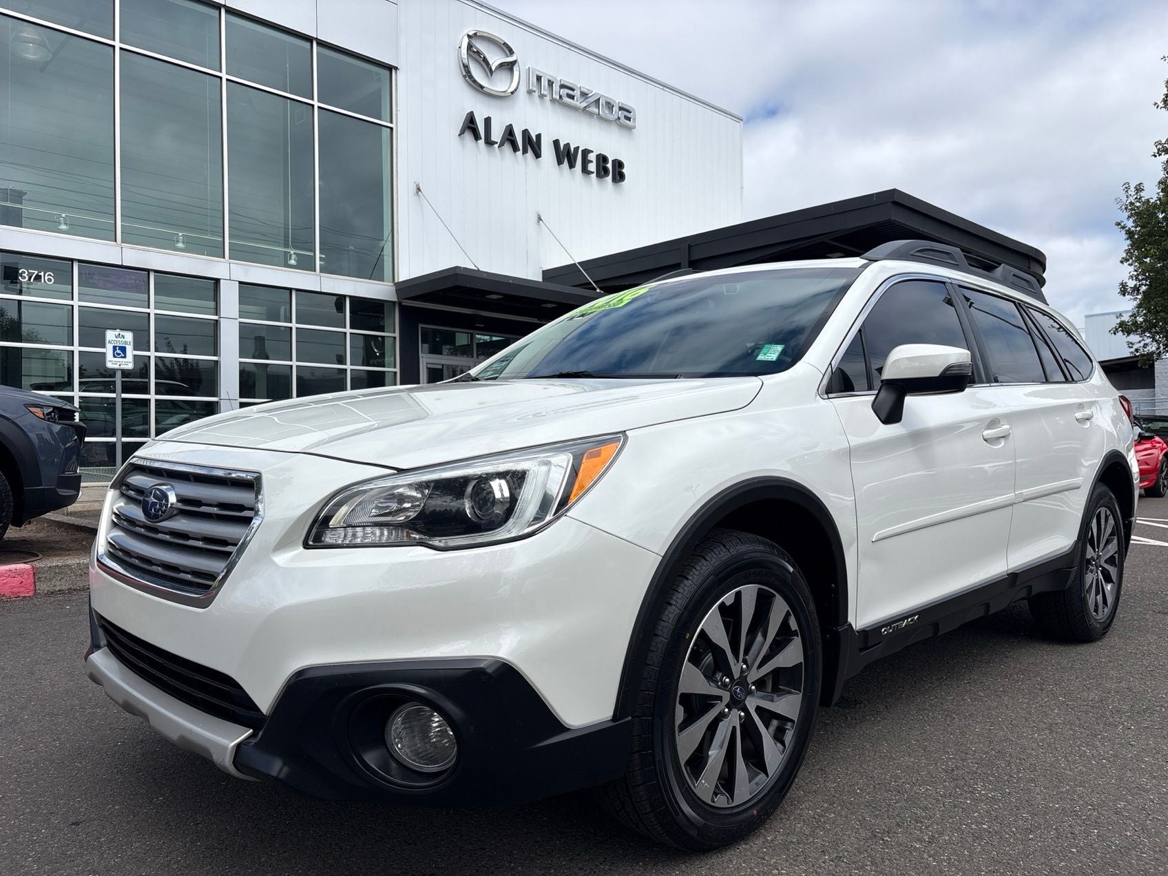 2016 Subaru Outback 3.6R Limited in Crystal White Pearl — front three-quarter view