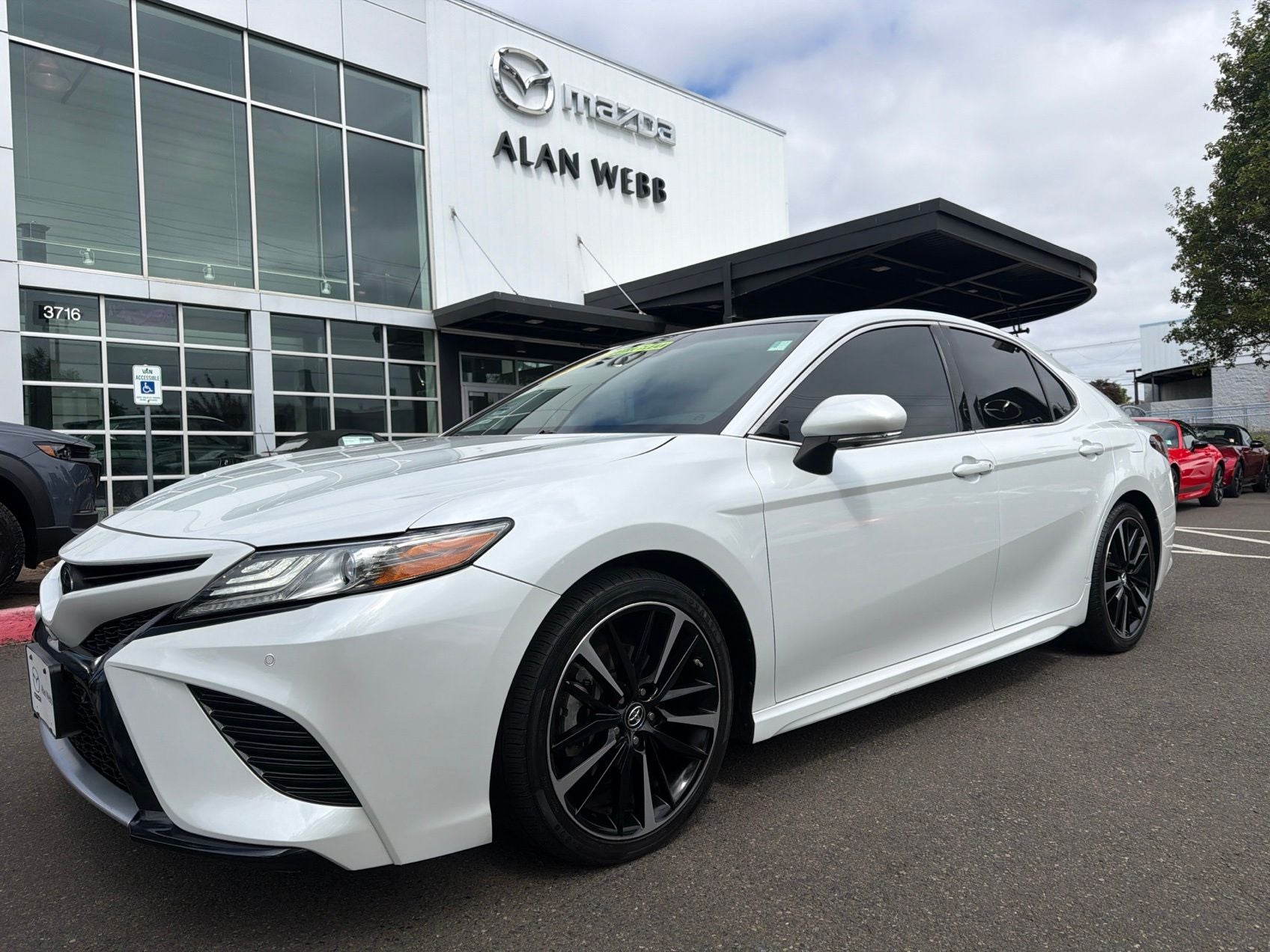 2018 Toyota Camry XSE V6 in Pearl — front three-quarter view