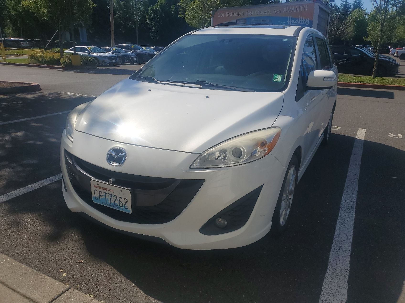 2014 Mazda Mazda5 Grand Touring in Crystal White Pearl — front three-quarter view