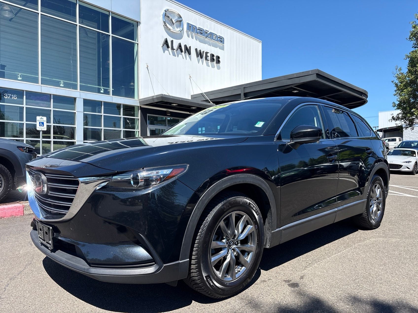 2019 Mazda Mazda CX-9 Touring in Jet Black Mica — front three-quarter view