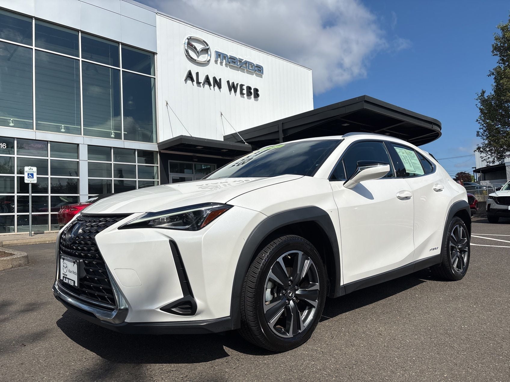 2019 Lexus UX 250h Base in White Pearl — front three-quarter view