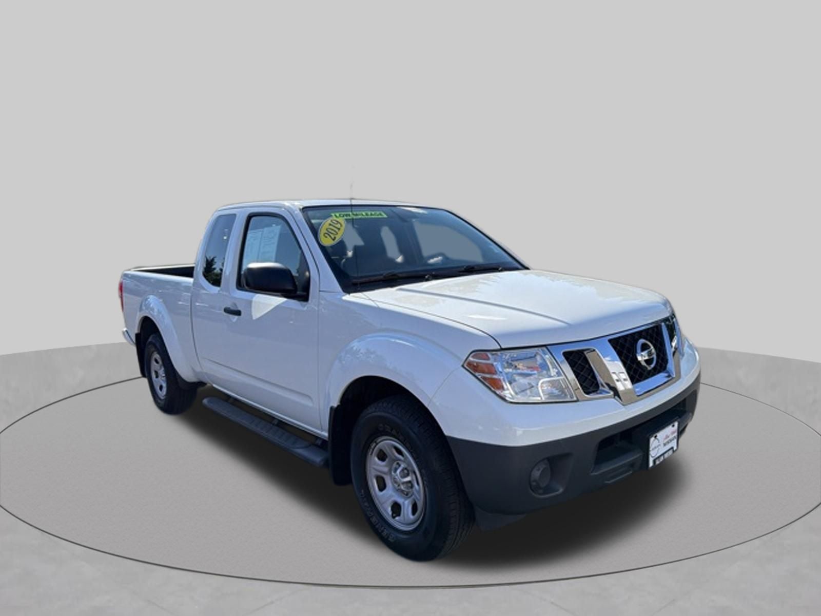 2019 Nissan Frontier S in Glacier White — front three-quarter view