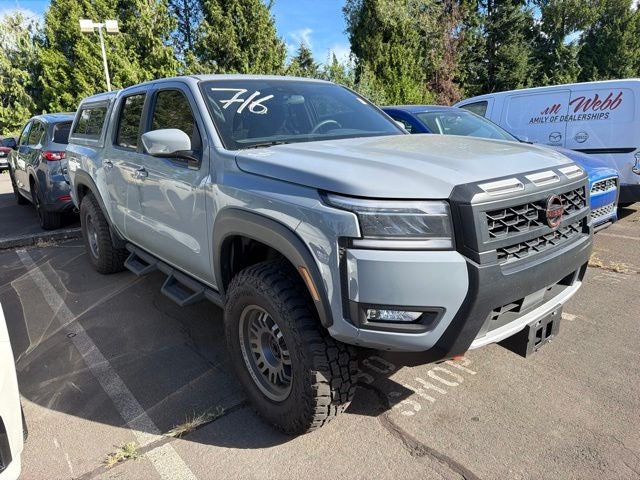 2025 Nissan Frontier PRO-4X in Boulder Gray Pearl — front three-quarter view