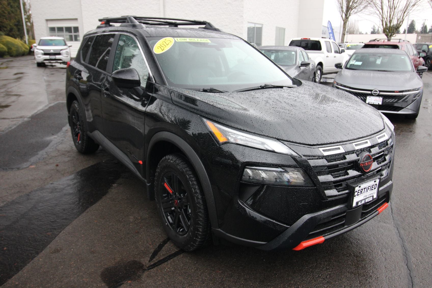 2025 Nissan Rogue Rock Creek Certified in Super Black — front three-quarter view