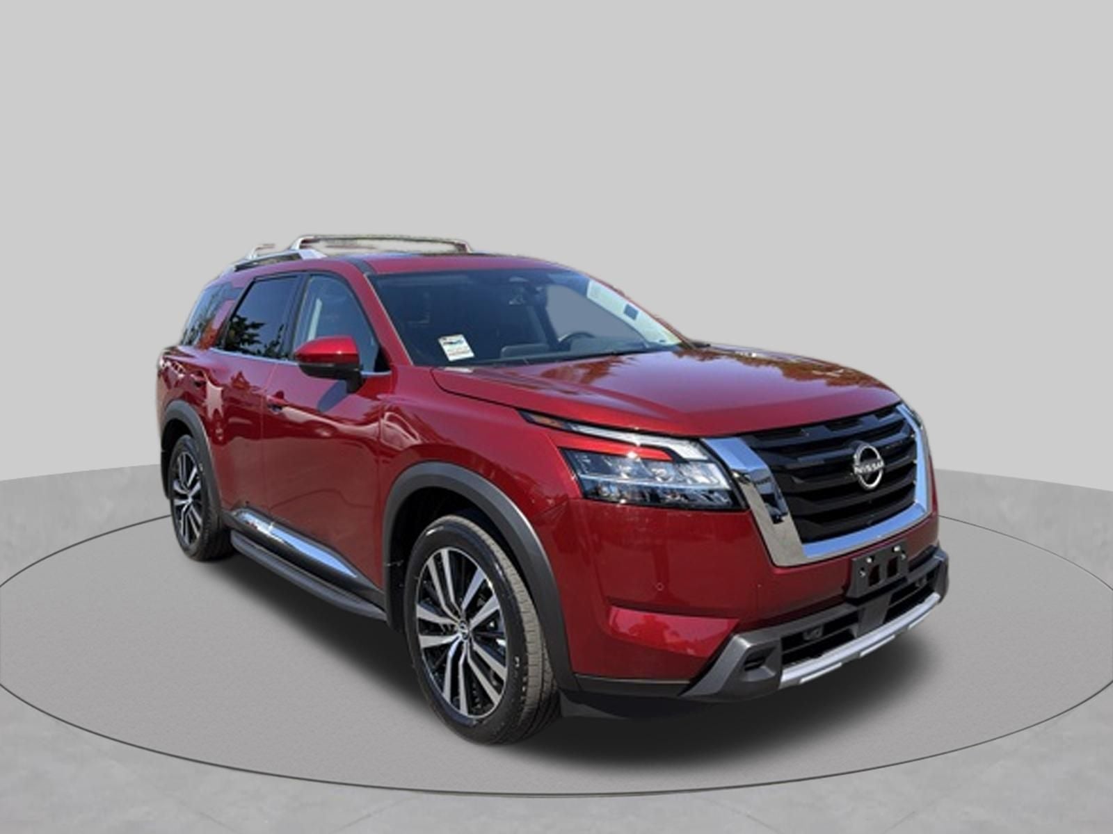 2024 Nissan Pathfinder Platinum in Scarlet Ember — front three-quarter view