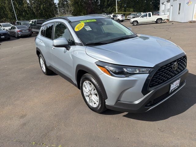 2023 Toyota Corolla Cross LE in Silver — front three-quarter view